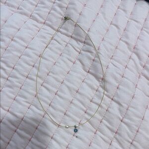 Elegant Gold Necklace with Pearl and Evil Eye Charm